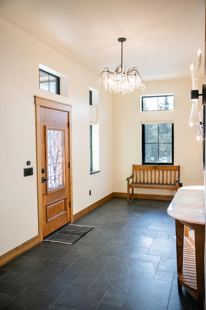 Kenai River Timber Estate — Grand Timber Foyer, Carved Entry Door & Crystal Chandelier