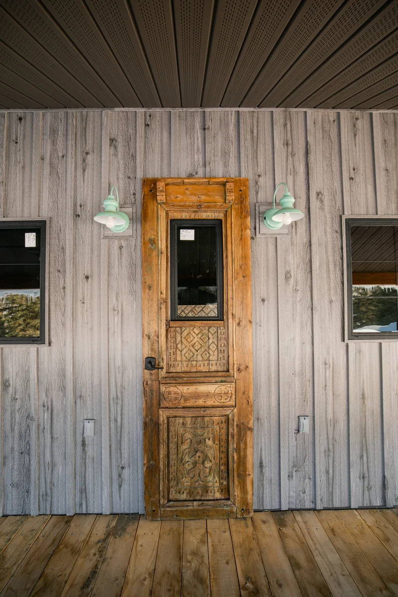 Sterling Timber Workshop — Carved Passage Door & Seafoam Gooseneck Sconces